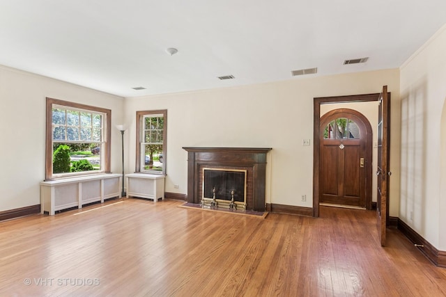 733 N Kensington Ave, La Grange Park, IL 60526 - unfurnished living room with wood finished floors and a fireplace with flush hearth