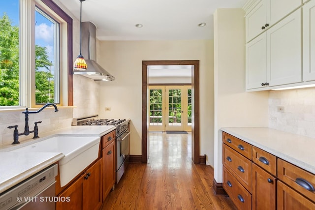 733 N Kensington Ave, La Grange Park, IL 60526 - kitchen with wall chimney exhaust hood, stainless steel appliances, light countertops, wood finished floors, and recessed lighting