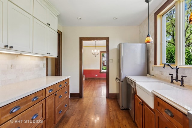 733 N Kensington Ave, La Grange Park, IL 60526 - kitchen featuring healthy amount of natural light, light countertops, and dark wood-style flooring