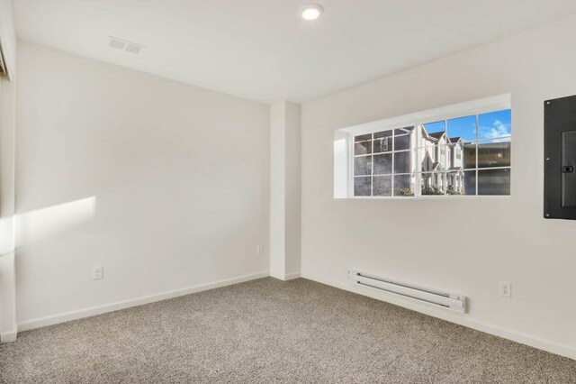 857 Briar Glen Ct, Hampshire, IL 60140 - unfurnished room with baseboard heating, carpet flooring, and electric panel