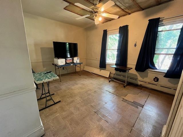 3651 W 64th Pl, Chicago, IL 60629 - living room with a ceiling fan and a baseboard heating unit