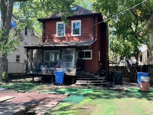 3651 W 64th Pl, Chicago, IL 60629 - back of property with a sunroom and roof with shingles