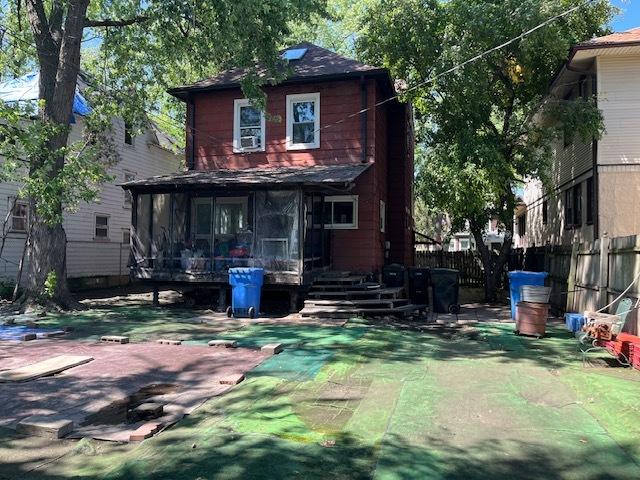 3651 W 64th Pl, Chicago, IL 60629 - rear view of house with a sunroom