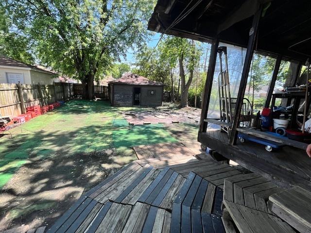3651 W 64th Pl, Chicago, IL 60629 - deck with a fenced backyard and an outdoor structure