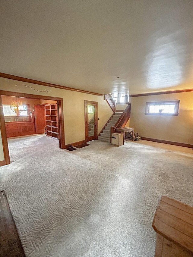 997 S Evergreen Ave, Kankakee, IL 60901 - basement featuring carpet, stairs, crown molding, and healthy amount of natural light