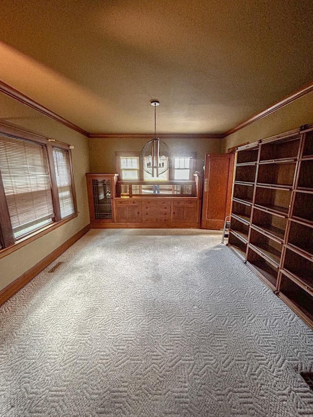997 S Evergreen Ave, Kankakee, IL 60901 - unfurnished dining area with ornamental molding, a chandelier, carpet floors, and a textured ceiling