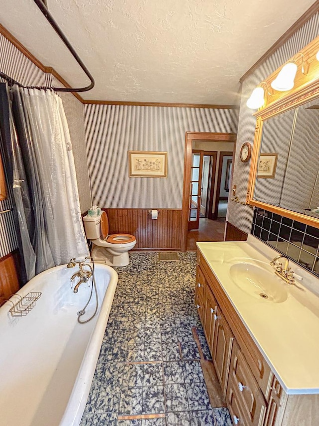 997 S Evergreen Ave, Kankakee, IL 60901 - full bath with a tub to relax in, vanity, crown molding, and a textured ceiling