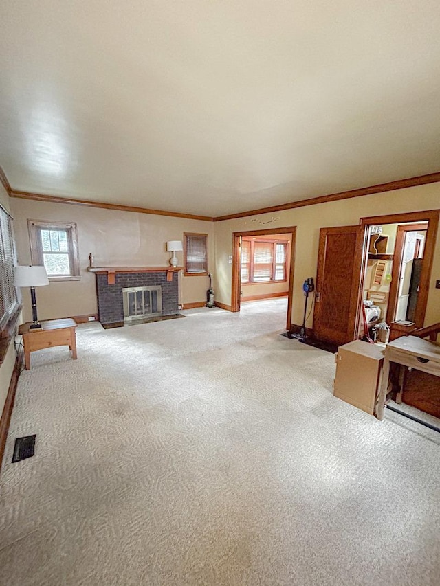 997 S Evergreen Ave, Kankakee, IL 60901 - living area with ornamental molding, light colored carpet, and a brick fireplace