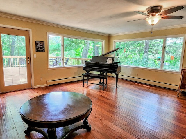 20798 White Oaks Rd, Morrison, IL 61270 - sitting room with hardwood / wood-style flooring, crown molding, ceiling fan, and a baseboard radiator