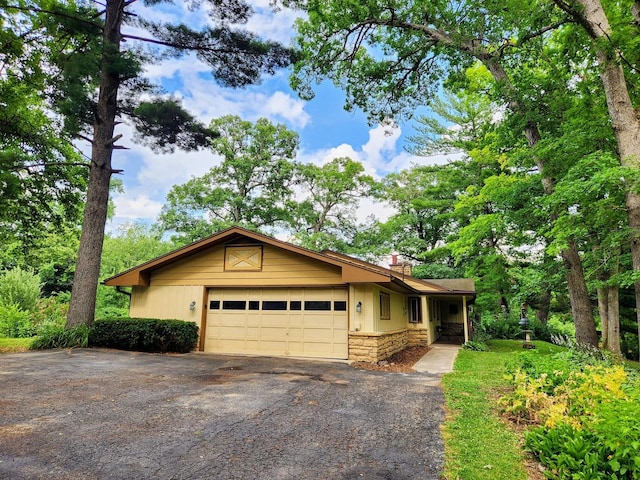 20798 White Oaks Rd, Morrison, IL 61270 - single story home featuring driveway, stone siding, and a garage