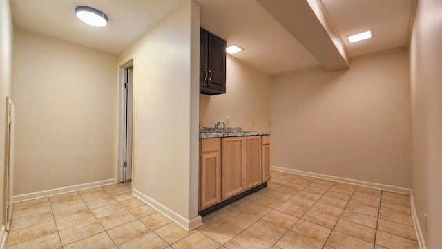 20798 White Oaks Rd, Morrison, IL 61270 - kitchen featuring light tile patterned floors and light stone countertops