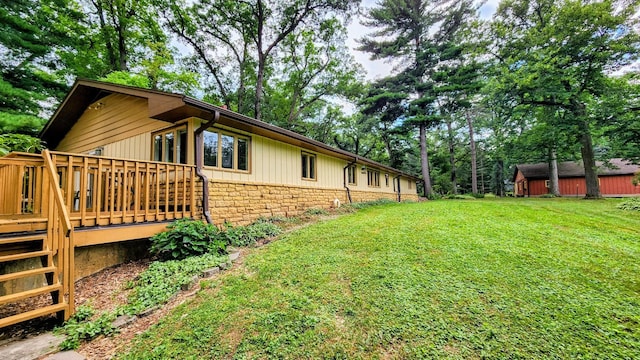20798 White Oaks Rd, Morrison, IL 61270 - view of side of home with a yard and a deck
