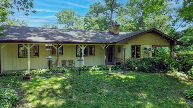 20798 White Oaks Rd, Morrison, IL 61270 - view of front of house featuring a chimney and a front yard