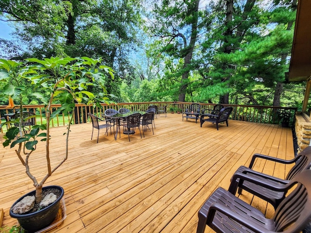 20798 White Oaks Rd, Morrison, IL 61270 - wooden terrace with outdoor dining area and view of wooded area