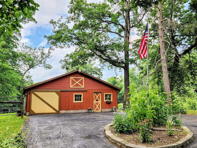 20798 White Oaks Rd, Morrison, IL 61270 - view of front of home featuring a barn, a detached garage, and an outdoor structure
