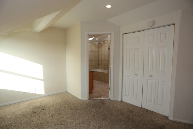 2458 N Clybourn Ave, Chicago, IL 60614 - unfurnished bedroom with carpet flooring, a closet, recessed lighting, and ensuite bath
