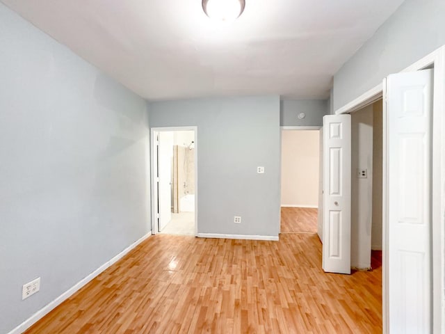 2458 N Clybourn Ave, Chicago, IL 60614 - unfurnished bedroom featuring light wood-type flooring and ensuite bathroom
