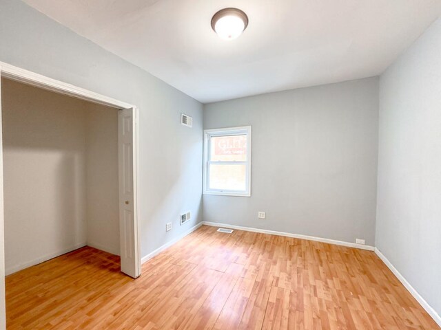 2458 N Clybourn Ave, Chicago, IL 60614 - unfurnished bedroom featuring light wood finished floors and baseboards