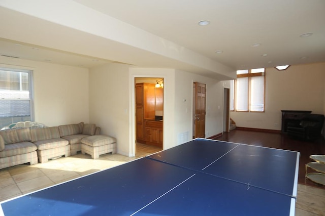 2458 N Clybourn Ave, Chicago, IL 60614 - game room featuring a wood stove, recessed lighting, and tile patterned flooring