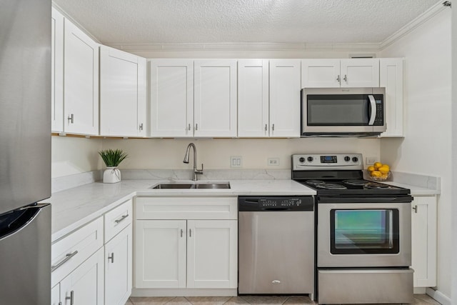 440 N Mcclurg Ct Unit 417, Chicago, IL 60611 - kitchen with appliances with stainless steel finishes, a textured ceiling, white cabinets, light stone counters, and ornamental molding