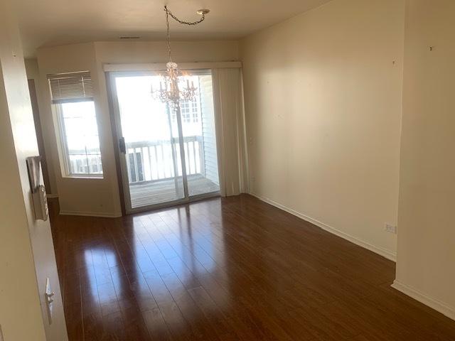 2235 Dawson Ln, Algonquin, IL 60102 - unfurnished dining area featuring a chandelier and dark wood-type flooring