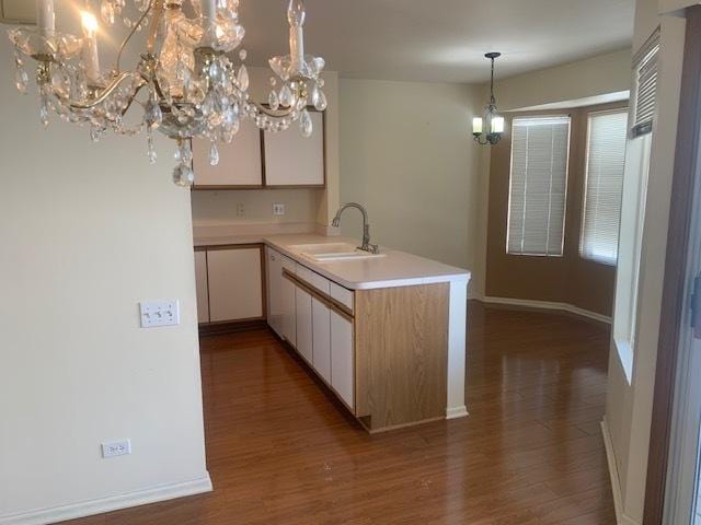 2235 Dawson Ln, Algonquin, IL 60102 - kitchen with a chandelier, wood finished floors, light countertops, and a peninsula