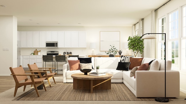 607 Wexford Dr, Elgin, IL 60124 - living room featuring light wood-style flooring and baseboards