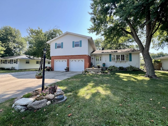 17 Park Dr, Villa Grove, IL 61956 - split level home featuring concrete driveway, brick siding, a garage, and a front yard