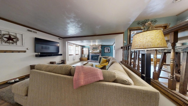 17 Park Dr, Villa Grove, IL 61956 - living room with wood finished floors, a fireplace, and ornamental molding