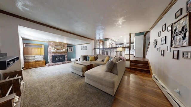 17 Park Dr, Villa Grove, IL 61956 - living area with a baseboard radiator, a fireplace, wood-type flooring, ornamental molding, and stairway