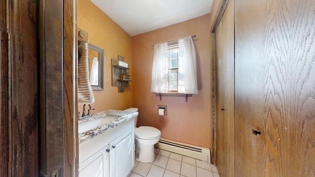 17 Park Dr, Villa Grove, IL 61956 - bathroom with a baseboard radiator, vanity, and tile patterned flooring