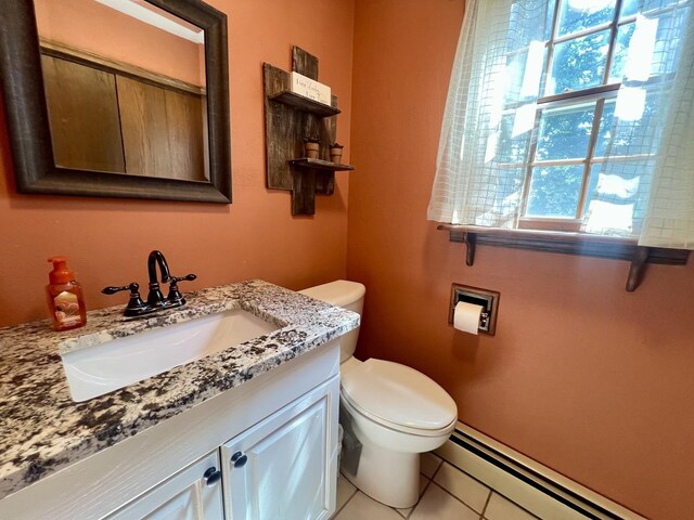 17 Park Dr, Villa Grove, IL 61956 - bathroom featuring vanity, a baseboard heating unit, and tile patterned floors