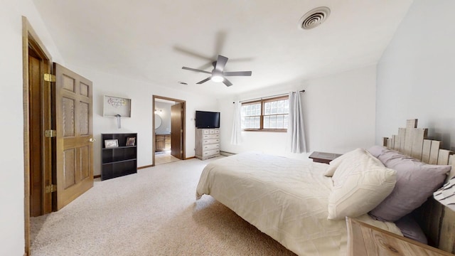17 Park Dr, Villa Grove, IL 61956 - bedroom featuring light colored carpet, ceiling fan, and ensuite bath