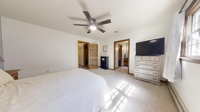 17 Park Dr, Villa Grove, IL 61956 - bedroom featuring a baseboard heating unit, light carpet, and a ceiling fan