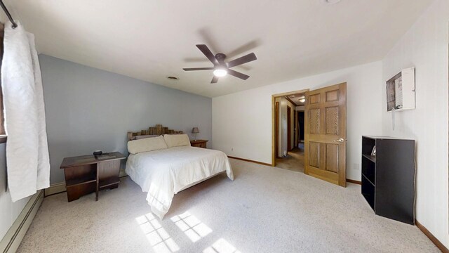 17 Park Dr, Villa Grove, IL 61956 - bedroom with ceiling fan, a baseboard heating unit, and carpet floors