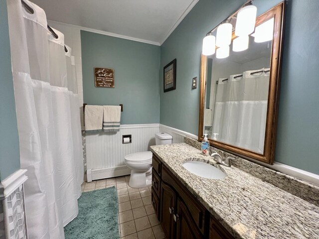 17 Park Dr, Villa Grove, IL 61956 - bathroom featuring a baseboard radiator, vanity, a wainscoted wall, ornamental molding, and tile patterned flooring