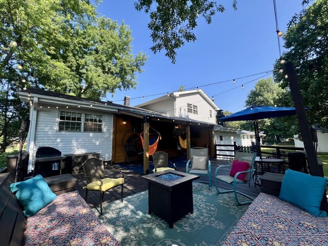17 Park Dr, Villa Grove, IL 61956 - back of property with an outdoor fire pit and a patio