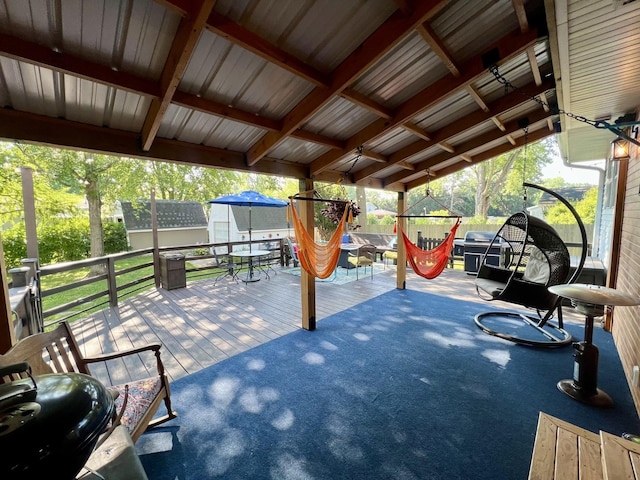 17 Park Dr, Villa Grove, IL 61956 - view of patio featuring a wooden deck, outdoor dining area, and a grill