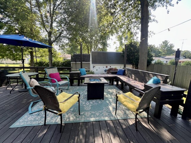 17 Park Dr, Villa Grove, IL 61956 - wooden deck with an outdoor fire pit