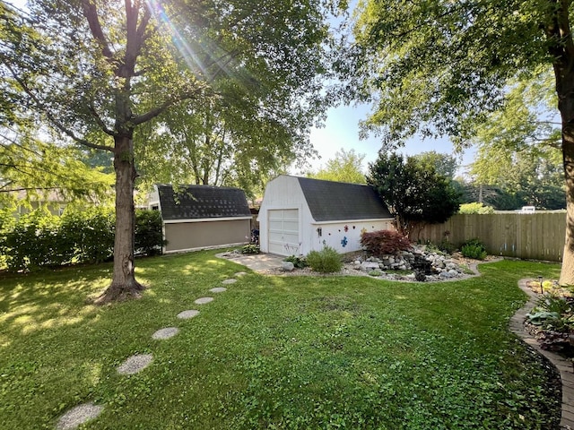 17 Park Dr, Villa Grove, IL 61956 - view of yard with a detached garage and a storage unit