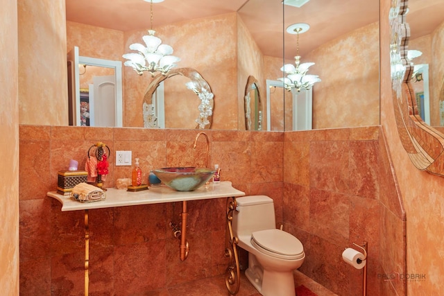 1130 Gavin Ct, Lake Forest, IL 60045 - bathroom featuring a chandelier, tile walls, and vanity