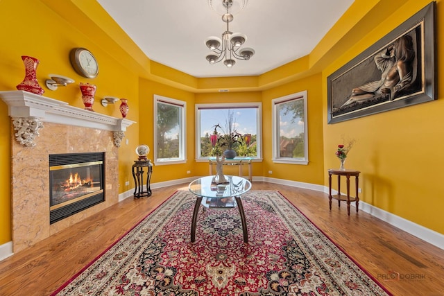 1130 Gavin Ct, Lake Forest, IL 60045 - living room featuring a tile fireplace, a chandelier, and wood finished floors