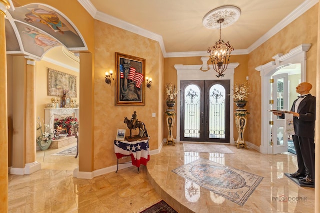 1130 Gavin Ct, Lake Forest, IL 60045 - entrance foyer featuring a chandelier, french doors, ornamental molding, marble tiled floors, and arched walkways