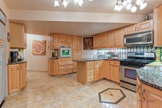 1130 Gavin Ct, Lake Forest, IL 60045 - kitchen with appliances with stainless steel finishes, a peninsula, light brown cabinets, and dark stone counters