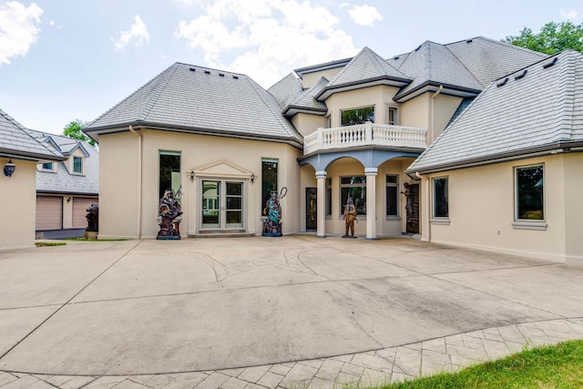 1130 Gavin Ct, Lake Forest, IL 60045 - rear view of property with a balcony, stucco siding, and a patio