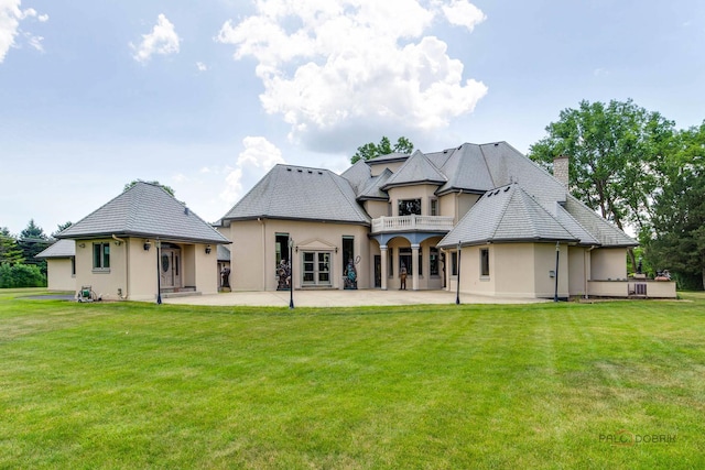 1130 Gavin Ct, Lake Forest, IL 60045 - back of house with stucco siding, a balcony, a chimney, a patio area, and a yard