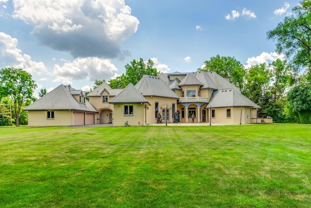 1130 Gavin Ct, Lake Forest, IL 60045 - rear view of property featuring stucco siding, a balcony, and a yard