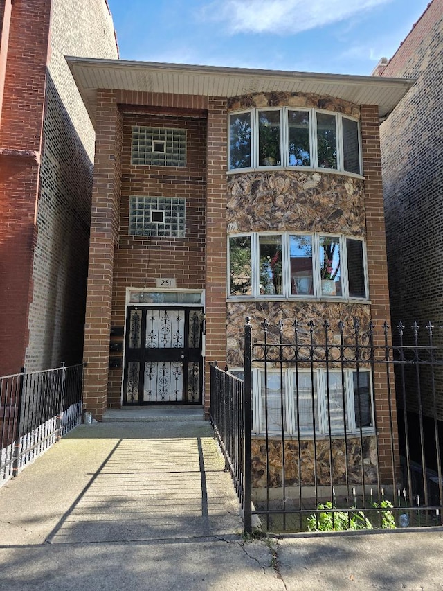 251 W 24th St Unit 1, Chicago, IL 60616 - view of front of property featuring stone siding and brick siding