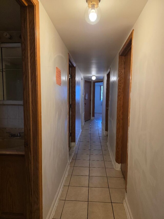 251 W 24th St Unit 1, Chicago, IL 60616 - hall with light tile patterned flooring and baseboards