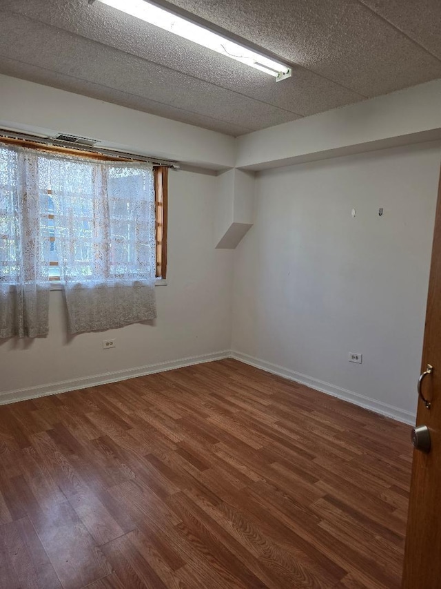 251 W 24th St Unit 1, Chicago, IL 60616 - empty room featuring wood finished floors and baseboards